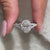 Custom engagement ring placed with handmade jewelry.