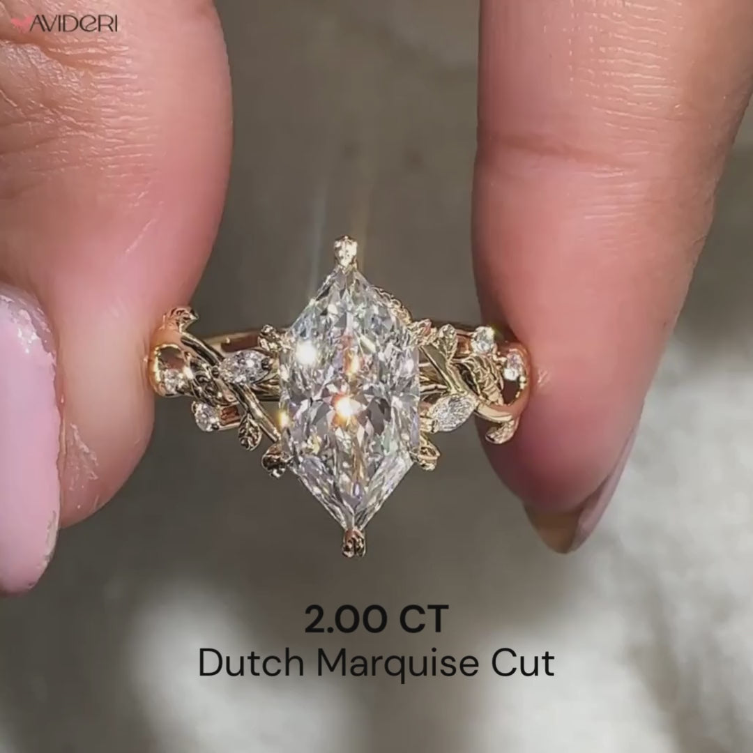 Marquise and round side stone in dutch marquise engagement ring.