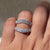 Handmade curved moissanite wedding band.
