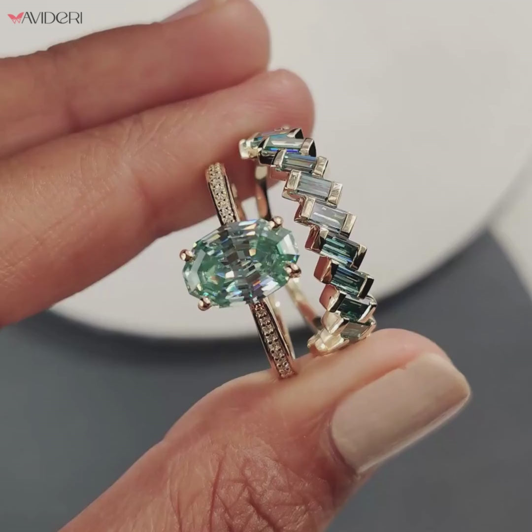 Oval Step Cut Ring paired with a Round Cut Channel Setting Band for a harmonious bridal set.