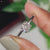 Cushion cut engagement ring featuring a lab grown diamond and solitaire style.