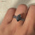 Black moissanite ring featuring a marquise shape for bold, dramatic style.