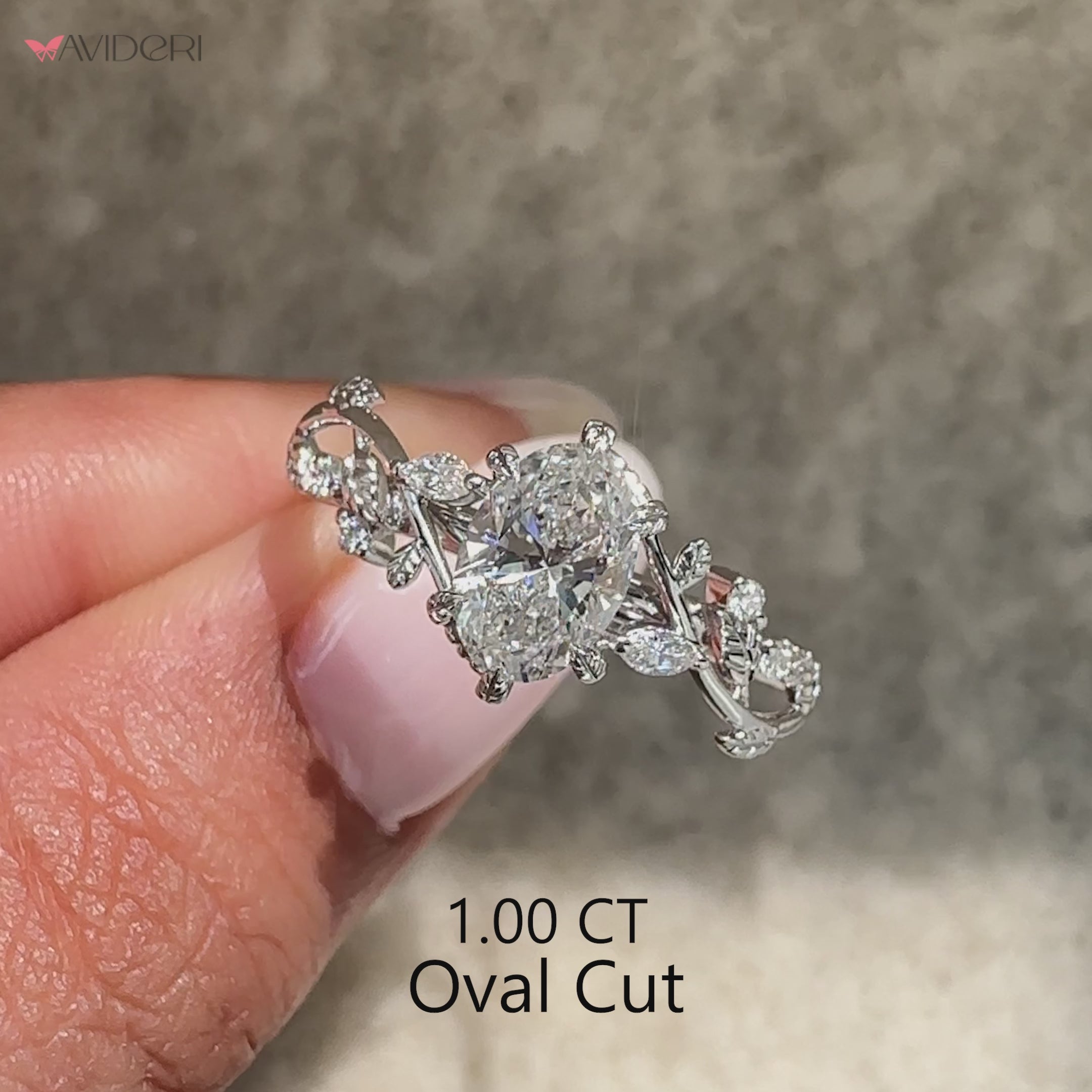 Lab grown oval diamond ring with artistic leaf style prongs.
