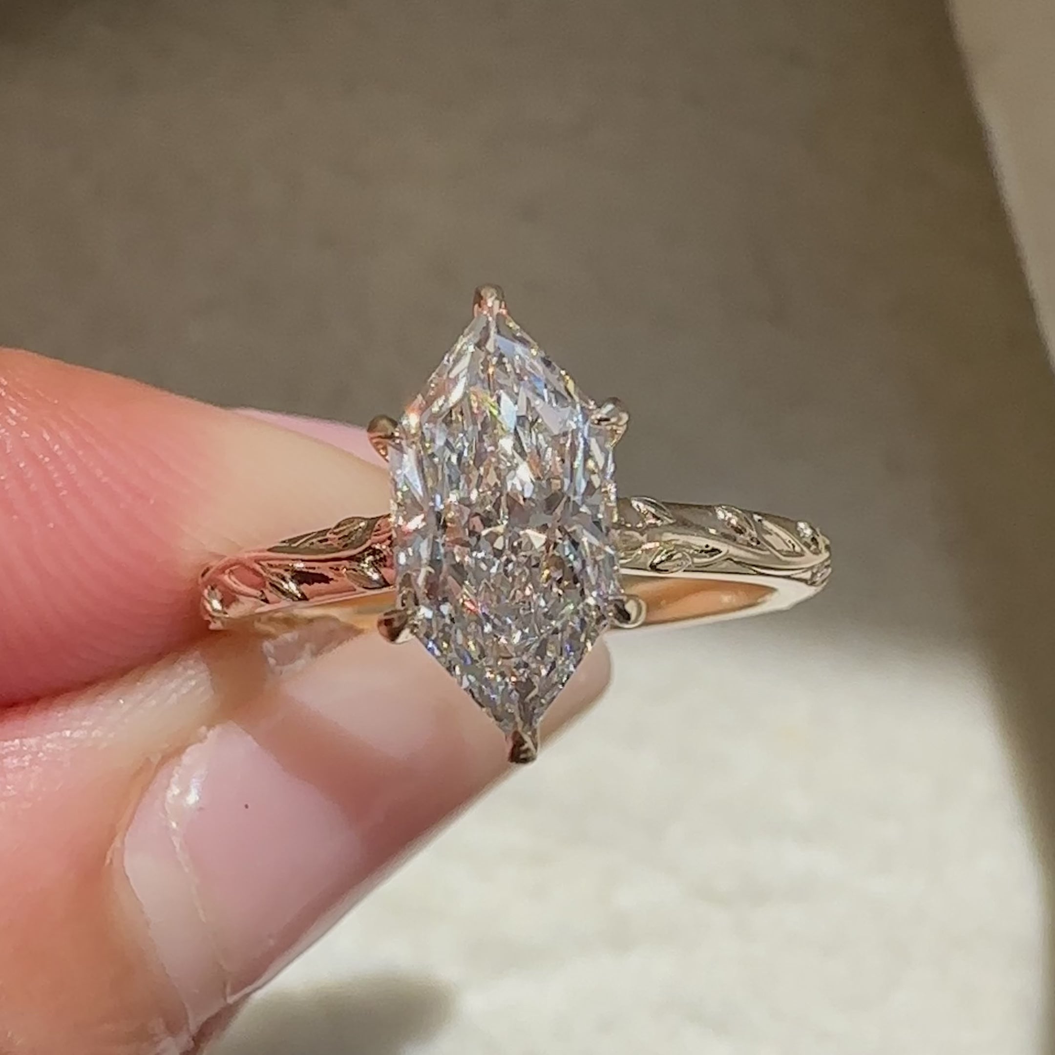 Dutch marquise ring with hidden round diamond halo.
