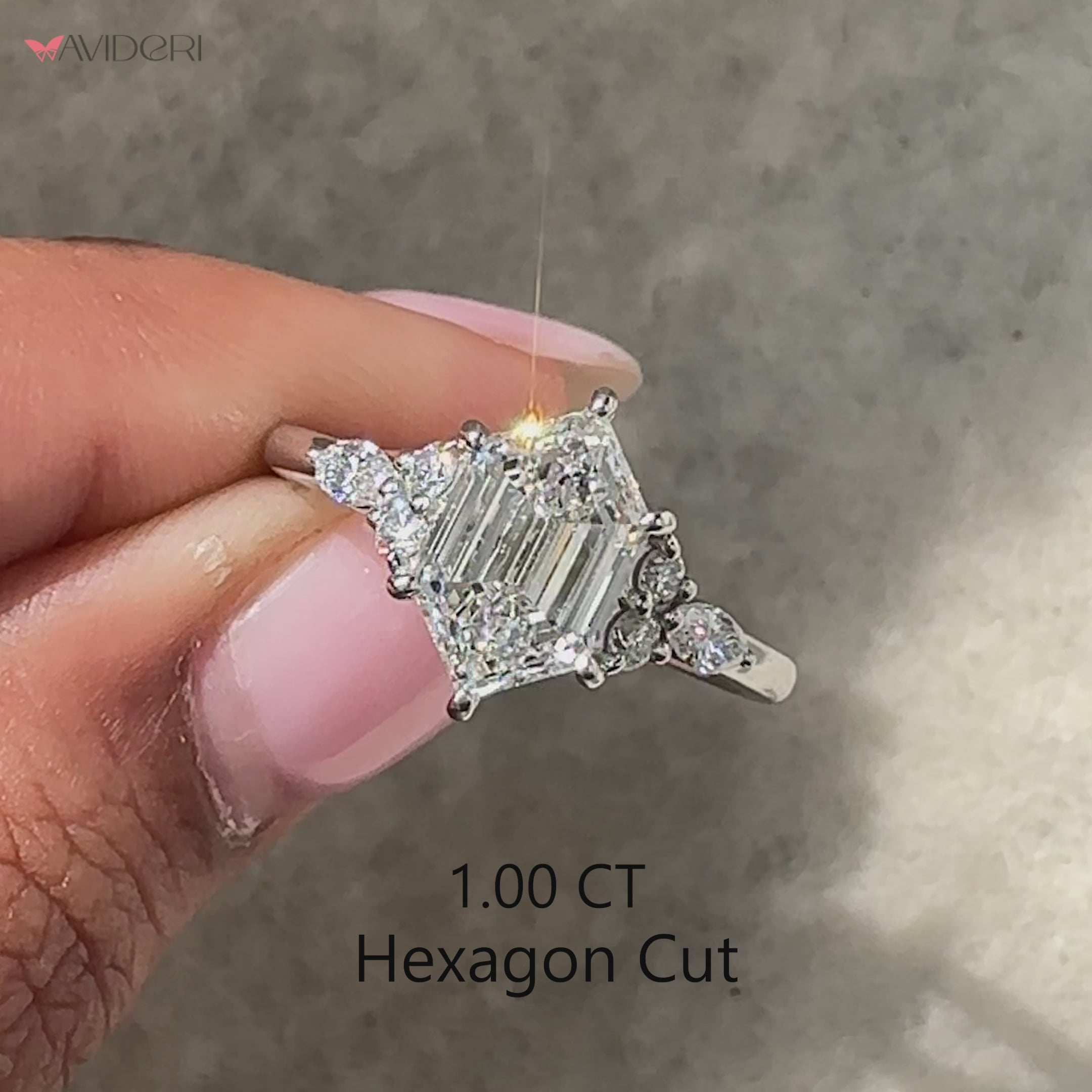 Lab grown diamond seven stone ring with hexagon center.