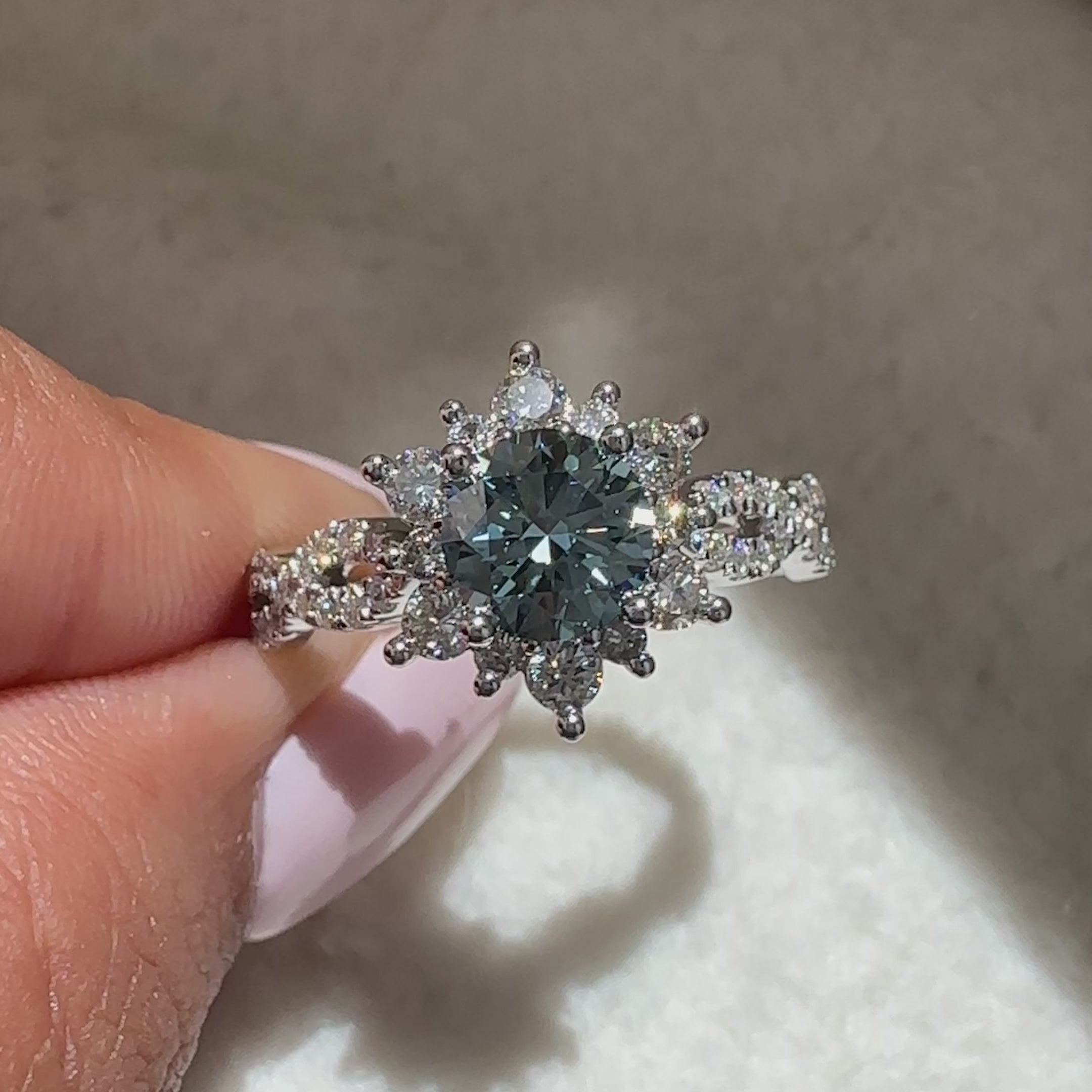 buy handmade engagement ring with round blue diamond and lab grown stones.