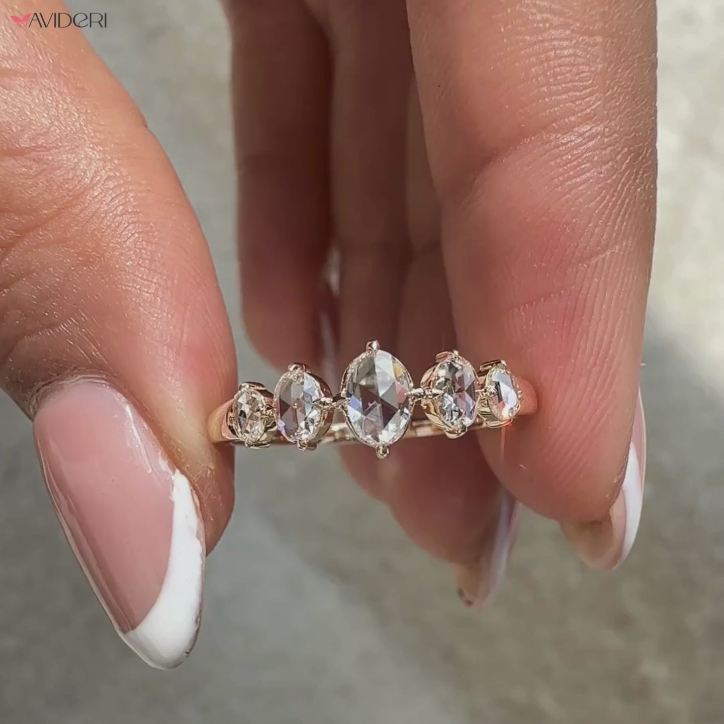 Avideri wedding band on oval rose cut diamond band.