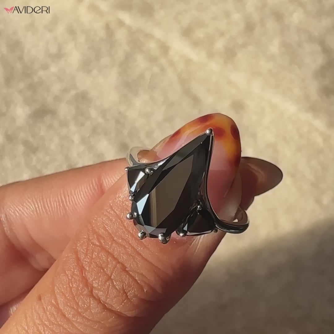 Avideri engagement ring showcasing a pear-cut moissanite center.