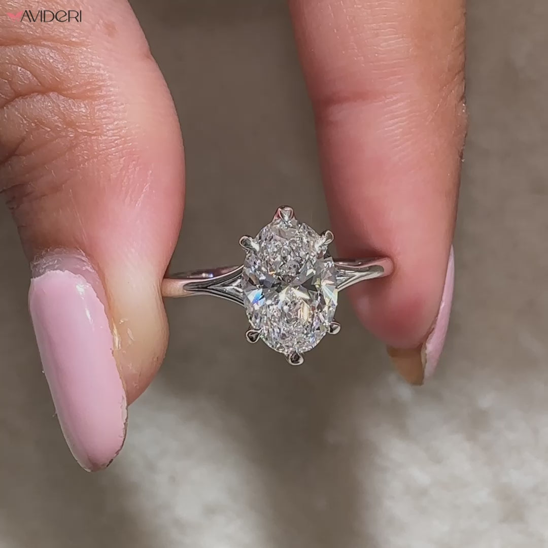 Avideri engagement ring with oval diamond and modern split shank.