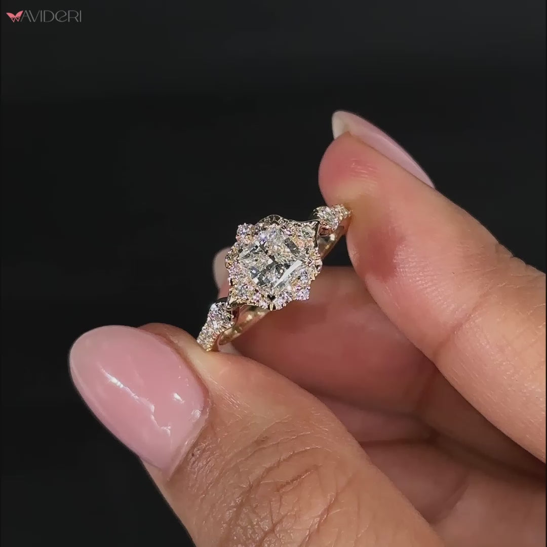 Princess cut diamond halo engagement ring in yellow gold.