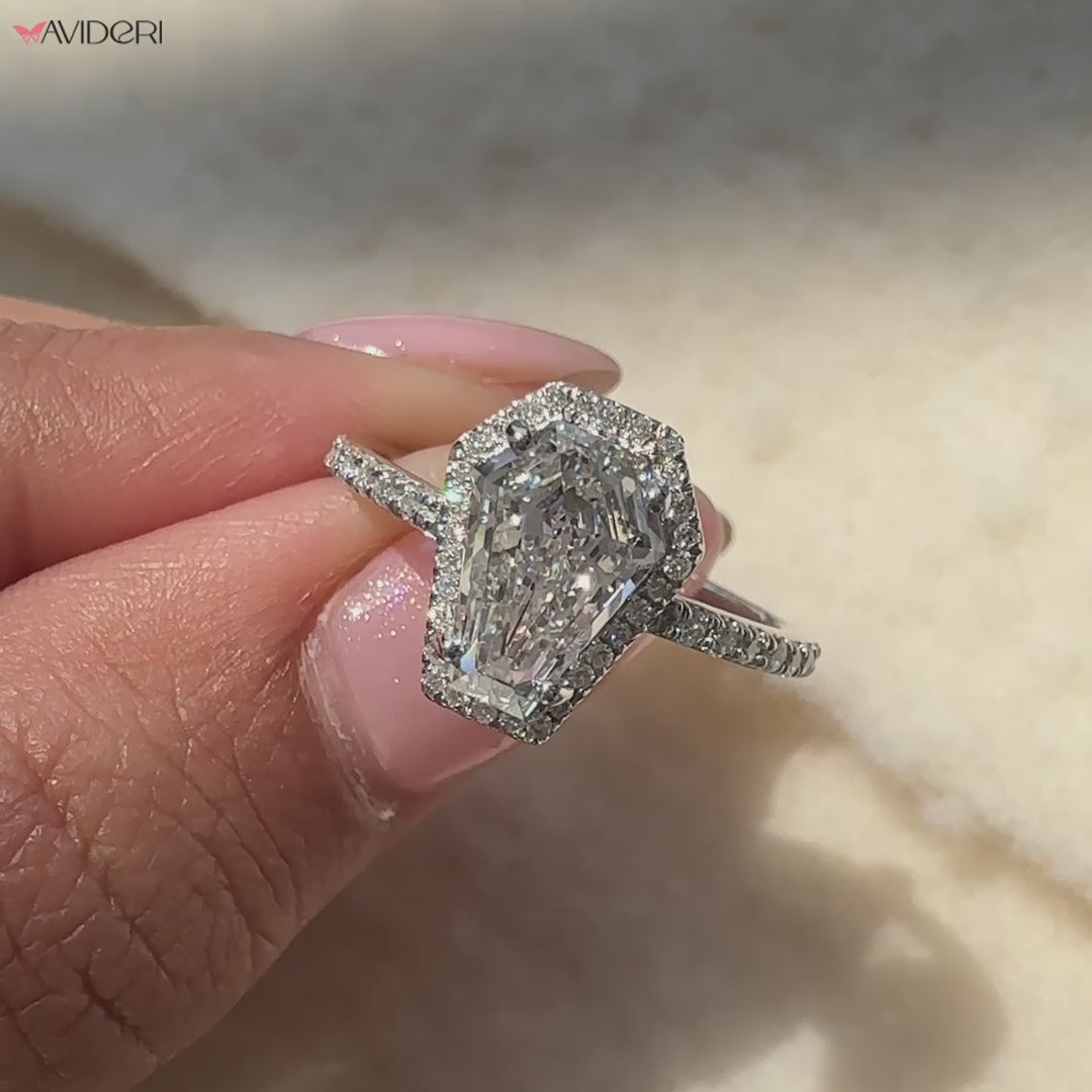 Avideri ring with 4 prong setting and unique pave details.