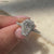 Avideri ring with 4 prong setting and unique pave details.