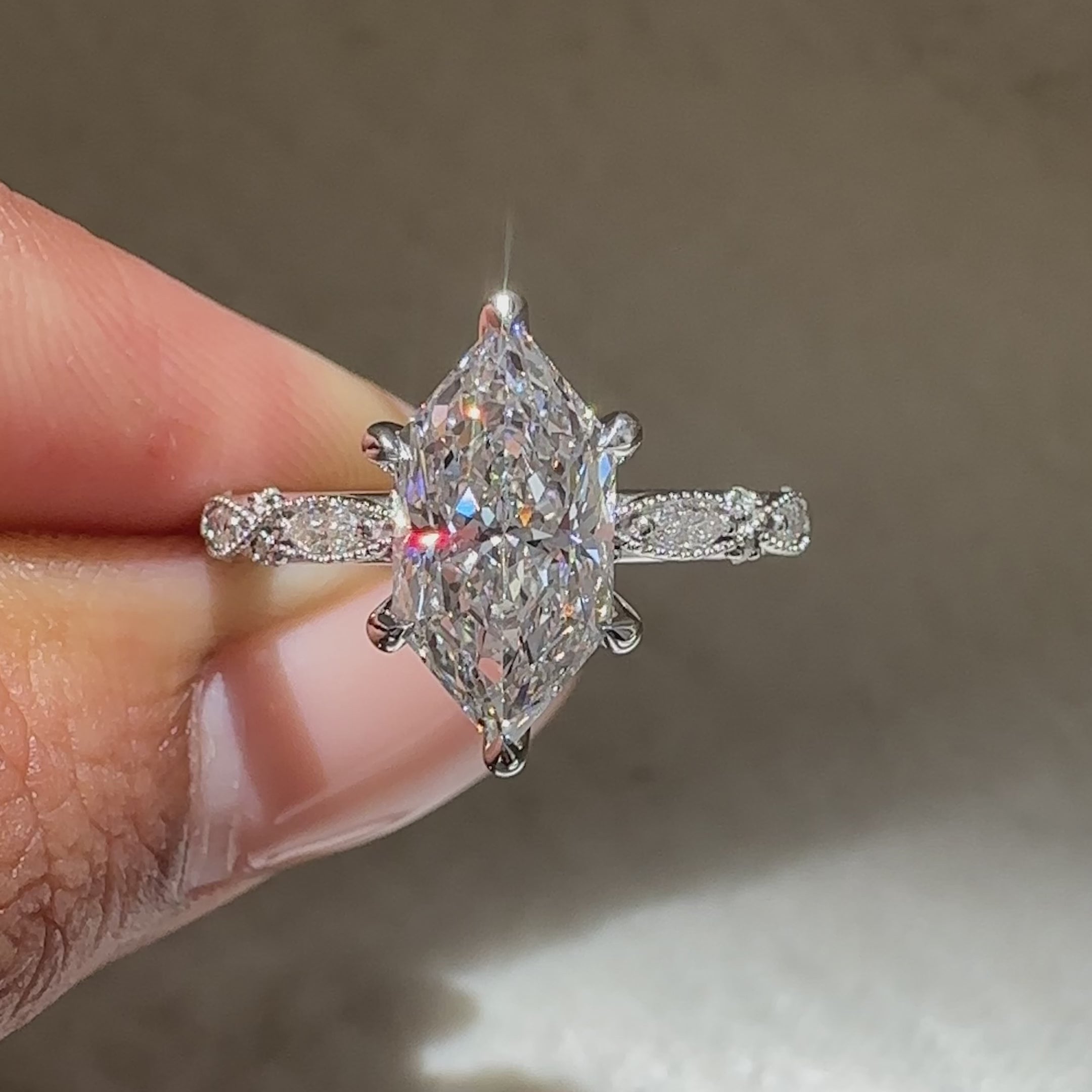 Dutch marquise lab diamond ring with detailed milgrain accents.
