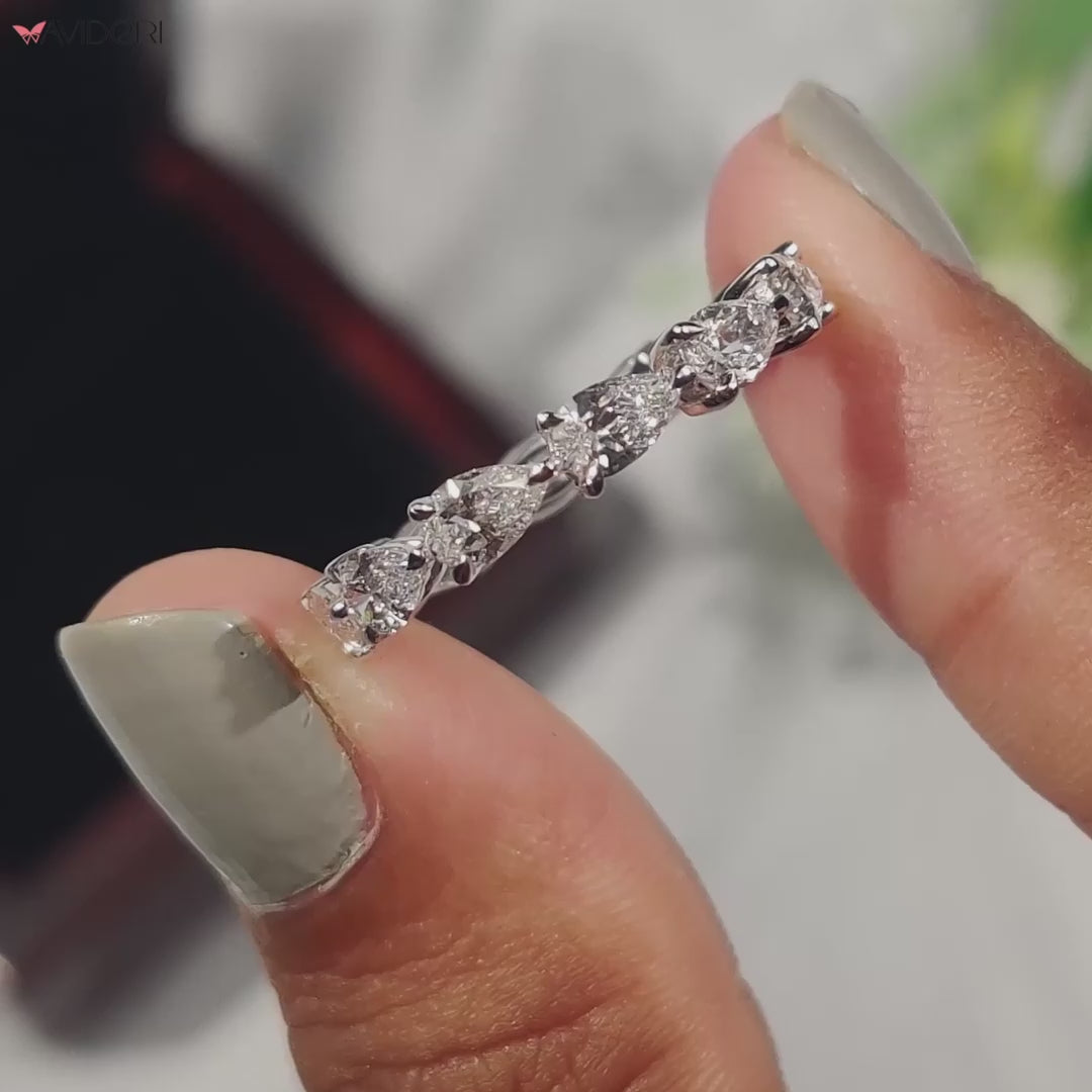 Pear-shaped eternity band featuring stunning diamonds.
