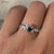 Black onyx ring paired with a heart cut engagement ring for a bold look.
