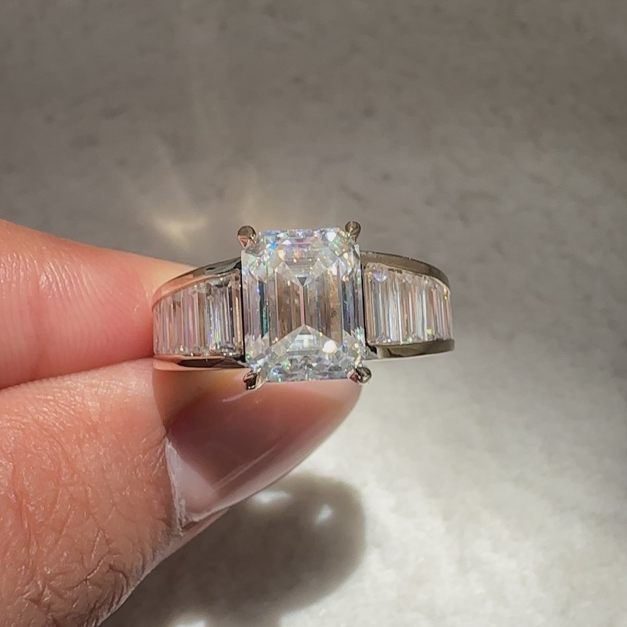 Emerald cut ring with baguette side stones.
