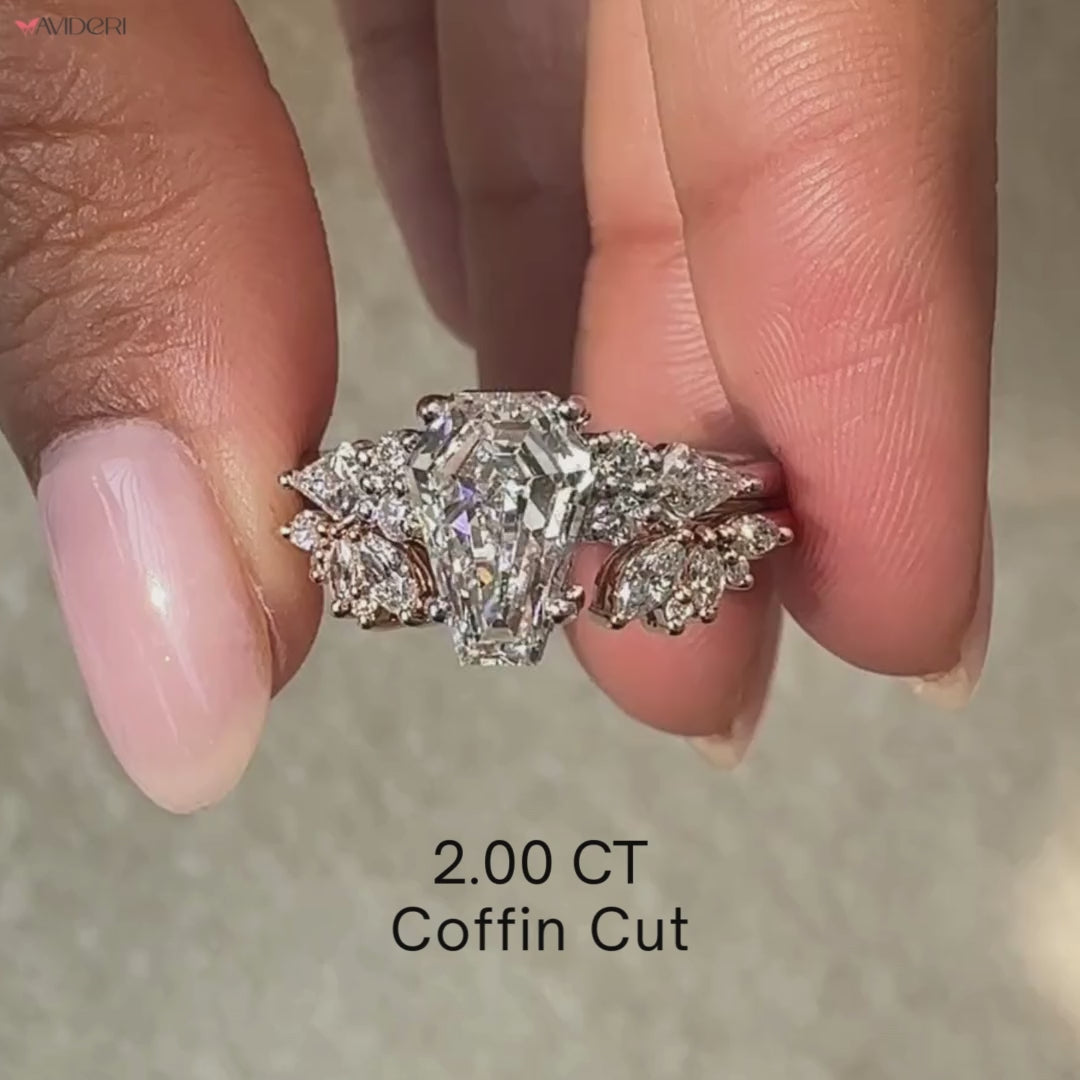 Coffin cut engagement ring paired with a cluster setting band.