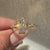 Elongated shield diamond ring with vintage art deco styling.
