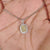 Avideri pendant with radiant cut and double halo charm.