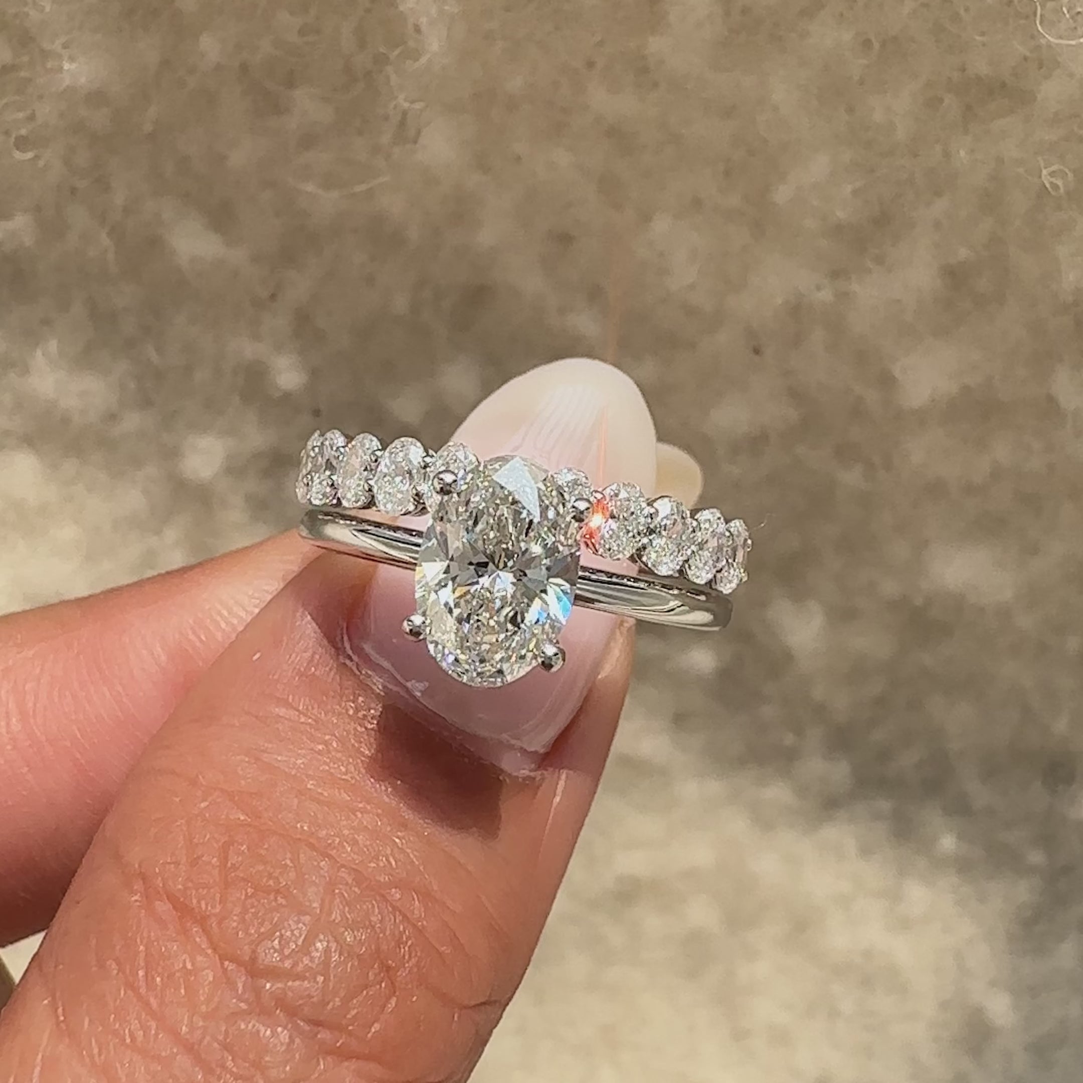 Elegant oval diamond ring with matching band.
