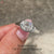 Handmade oval cut diamond ring with clean lines.

