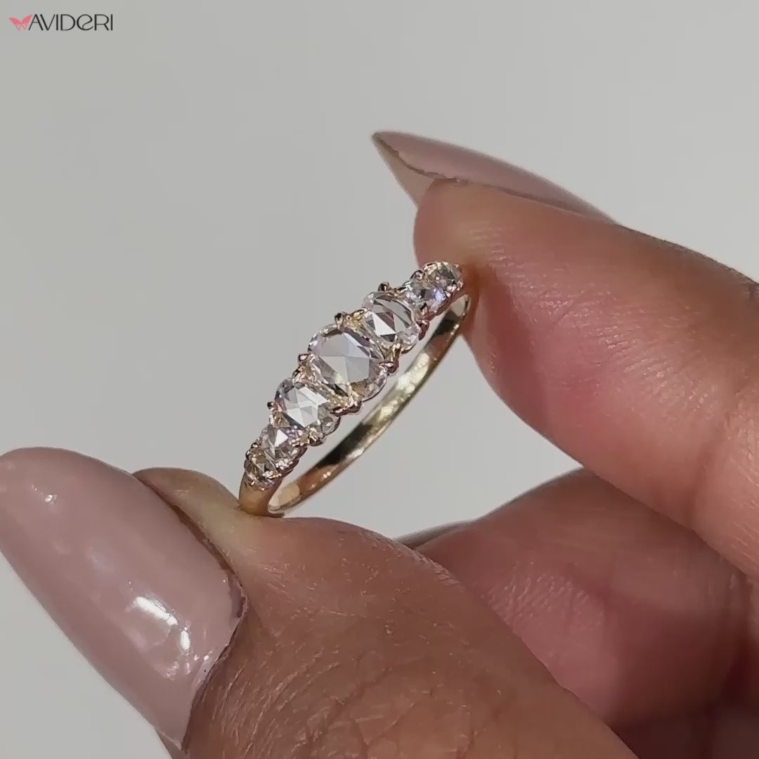 Seven stone diamond band with brilliant round diamonds.
