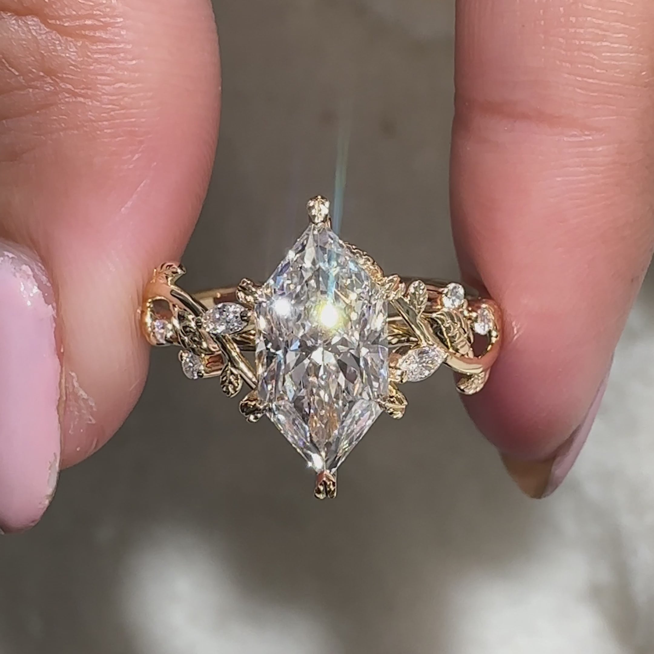 Marquise and round side stone in dutch marquise engagement ring.