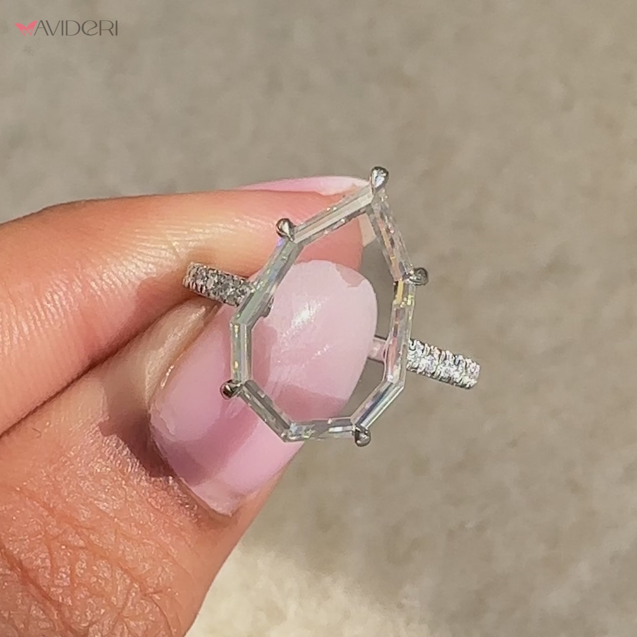 Avideri ring with a brilliant moissanite centerpiece.