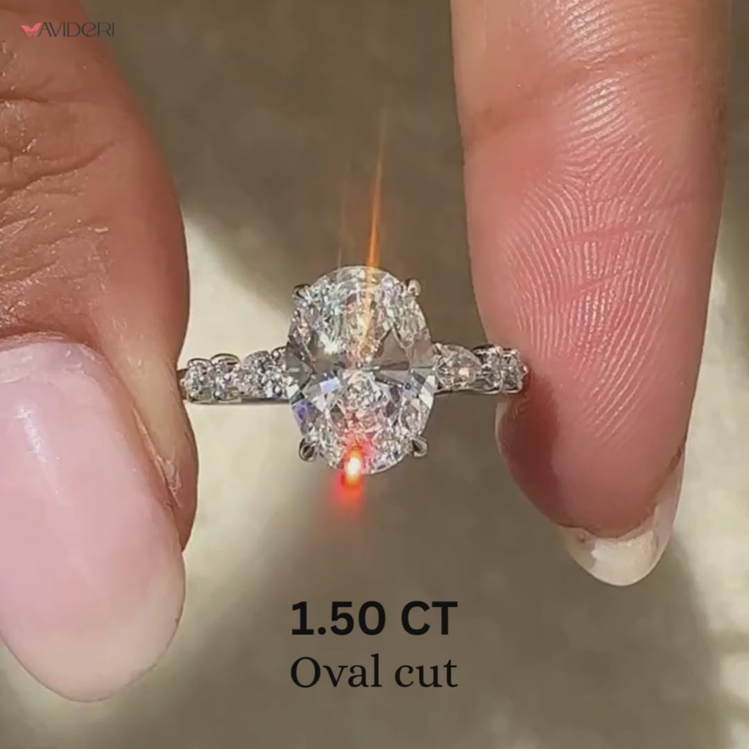 Oval and Pear Side Stone Seven Stone Ring.