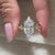 Avideri ring styled with 4 prong setting.