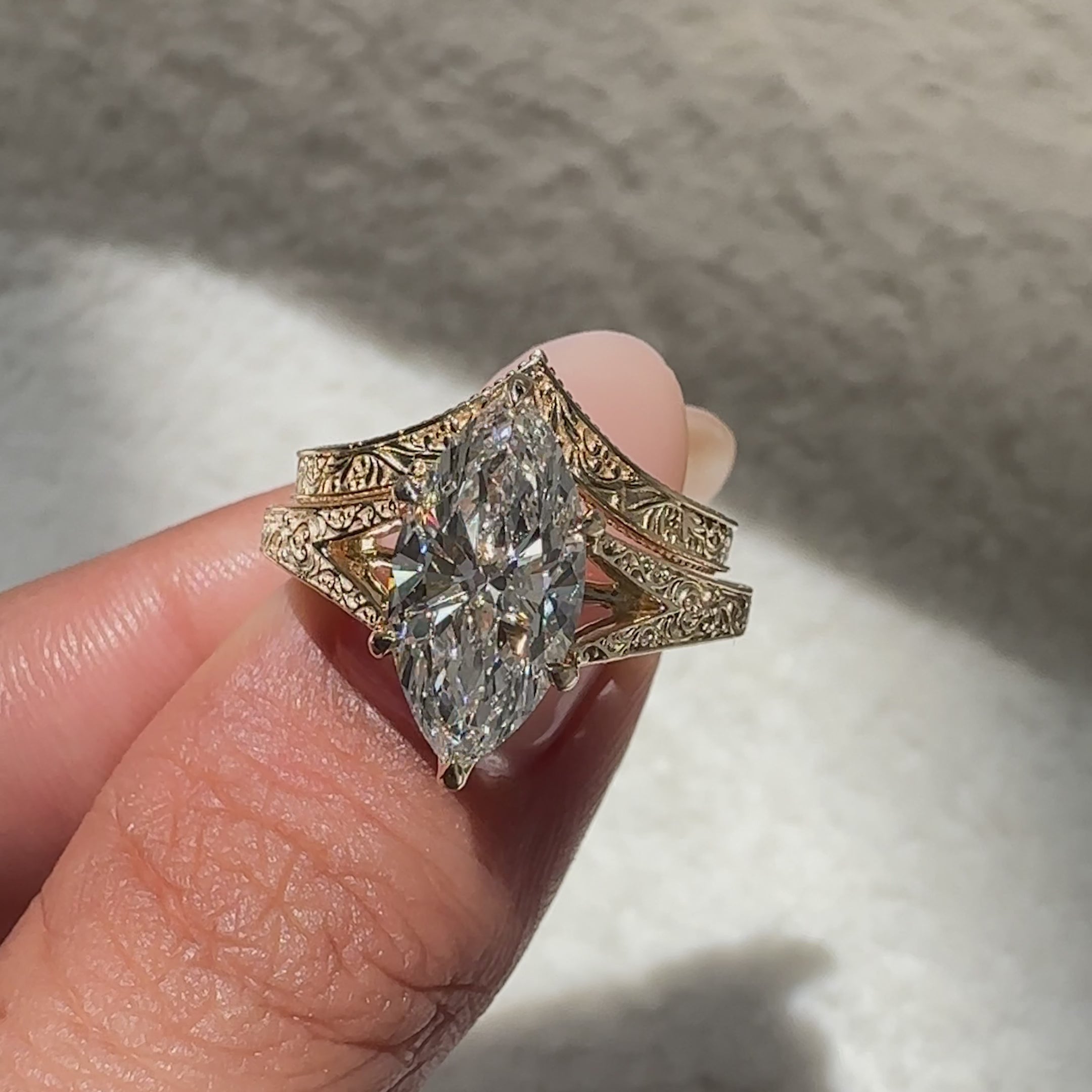 Antique marquise diamond engagement ring with curved pavé wedding band.