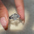Avideri bridal set with a cushion cut ring and classic wedding band.