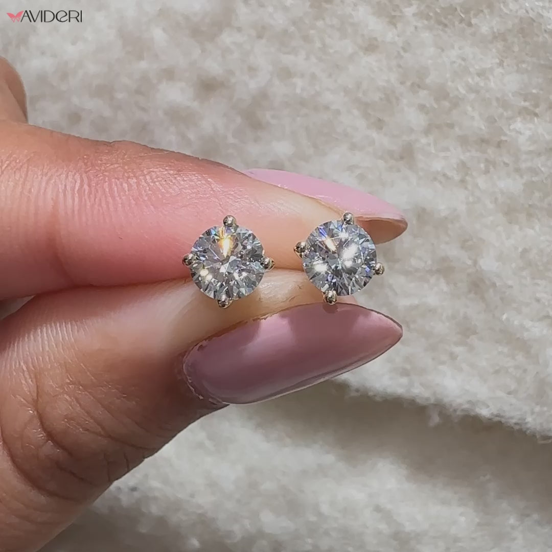 Prong set earrings with handmade diamond detail.