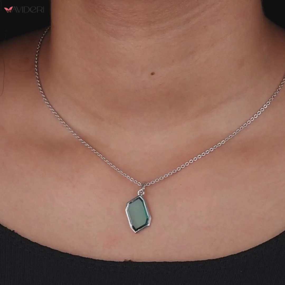 Pendant bezel setting highlights the gemstone's beauty.