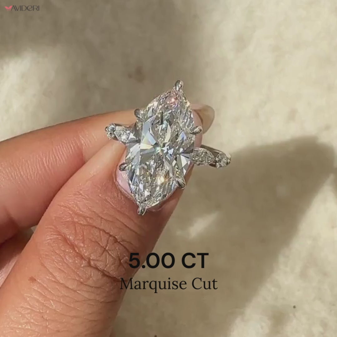 Avideri engagement ring with marquise cut and side stones.