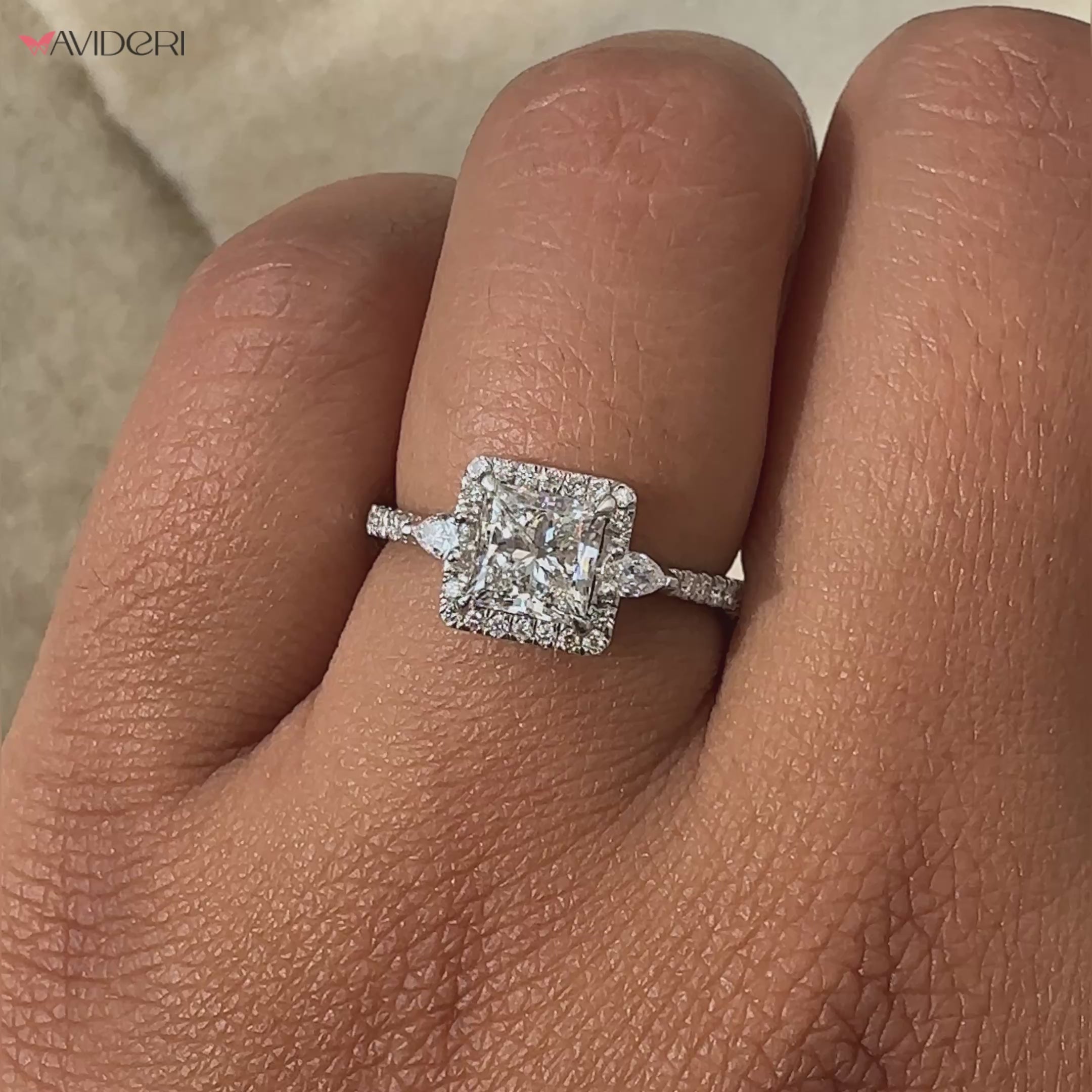 Princess cut engagement ring with a sleek design, crafted to highlight the beauty of the central princess diamond.
