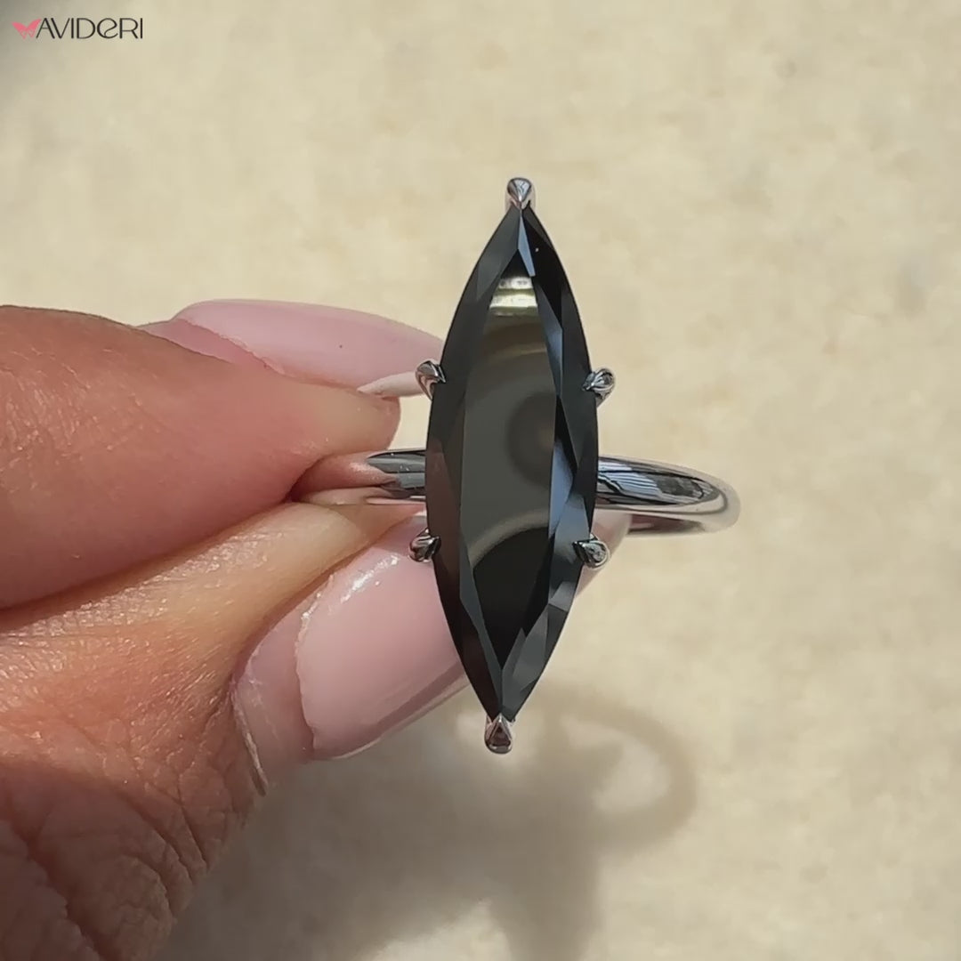 Avideri engagement ring featuring a marquise moissanite centerpiece.