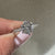 Round cut engagement ring with six claw prong design
