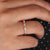 Moissanite gold wedding band pairs moissanite stones with the warmth of gold for a luxurious finish.
