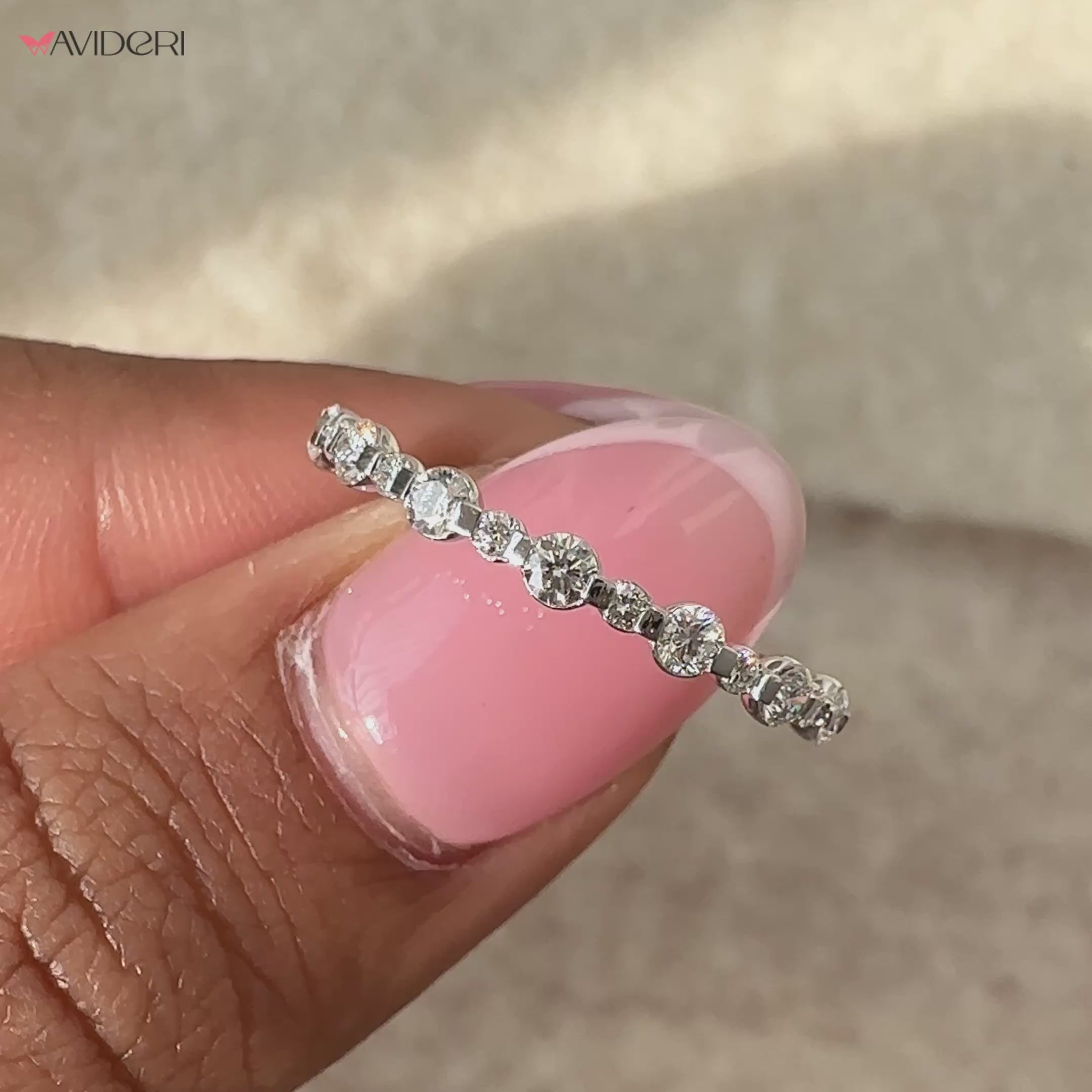 A classic bezel diamond wedding band with intricate craftsmanship and sparkle.
