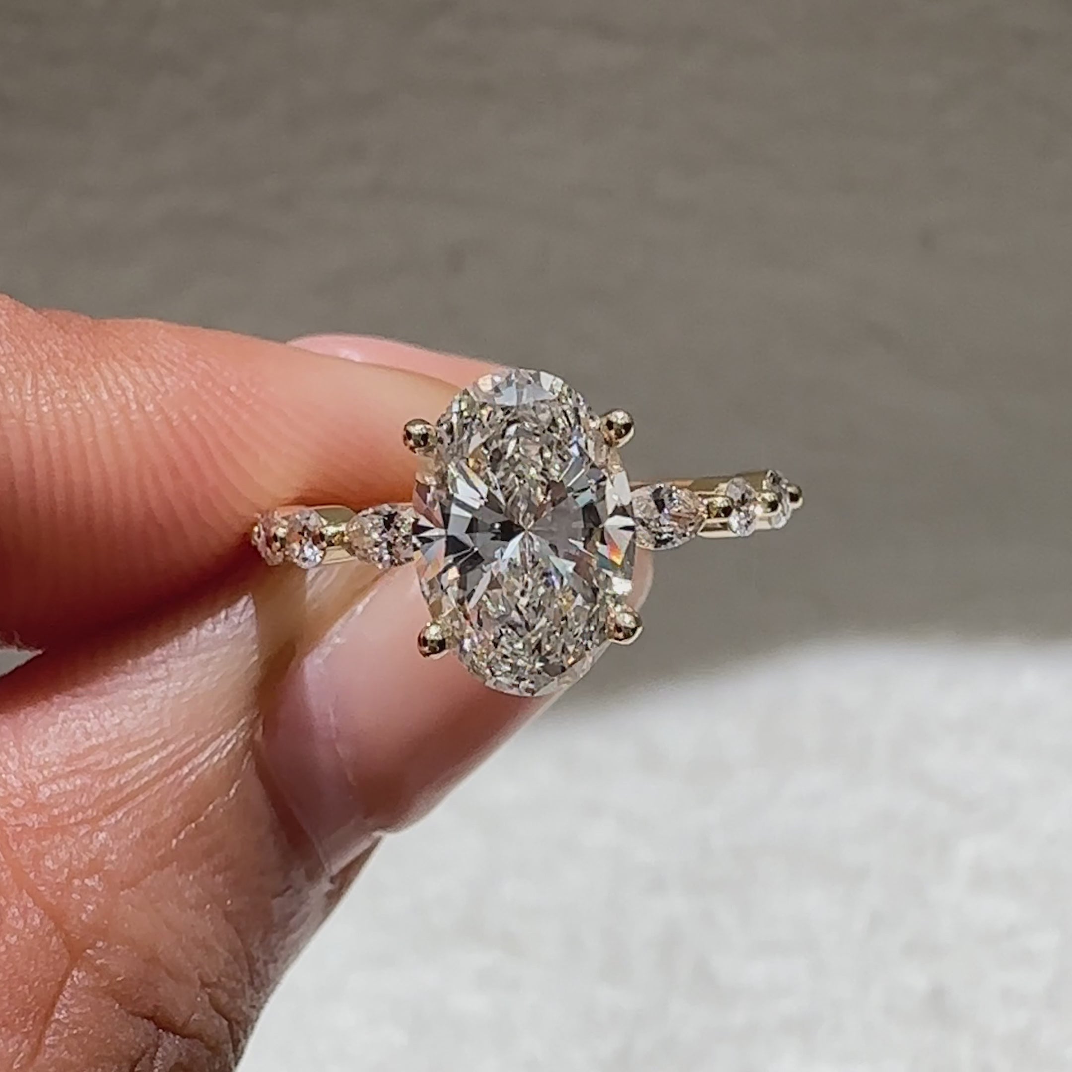 Oval cut diamond ring with basket setting and pave
