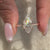 Custom engagement ring made with lab grown marquise diamond and handmade finish.
