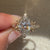 Marquise diamond ring with pave and leaf detailing.
