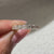 Semi eternity diamond band with asscher cut center stones
