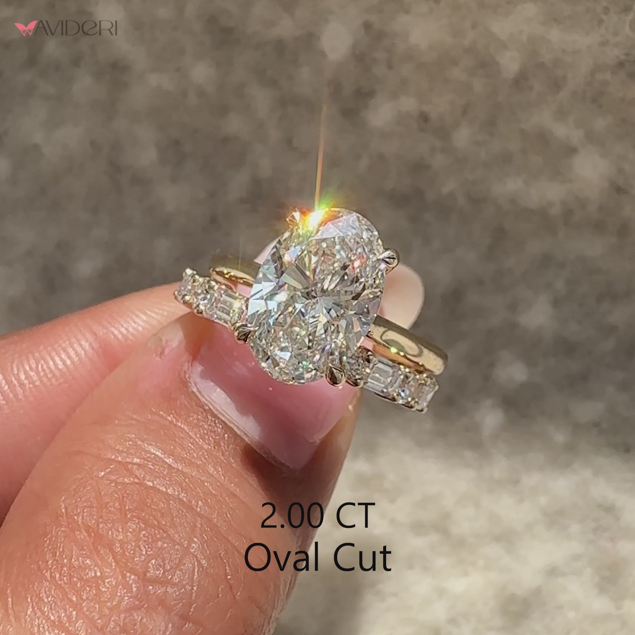 Avideri oval diamond ring with solitaire style and diamond band.