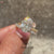 Avideri oval diamond ring with solitaire style and diamond band.