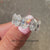 Simple white gold oval cut diamond band.