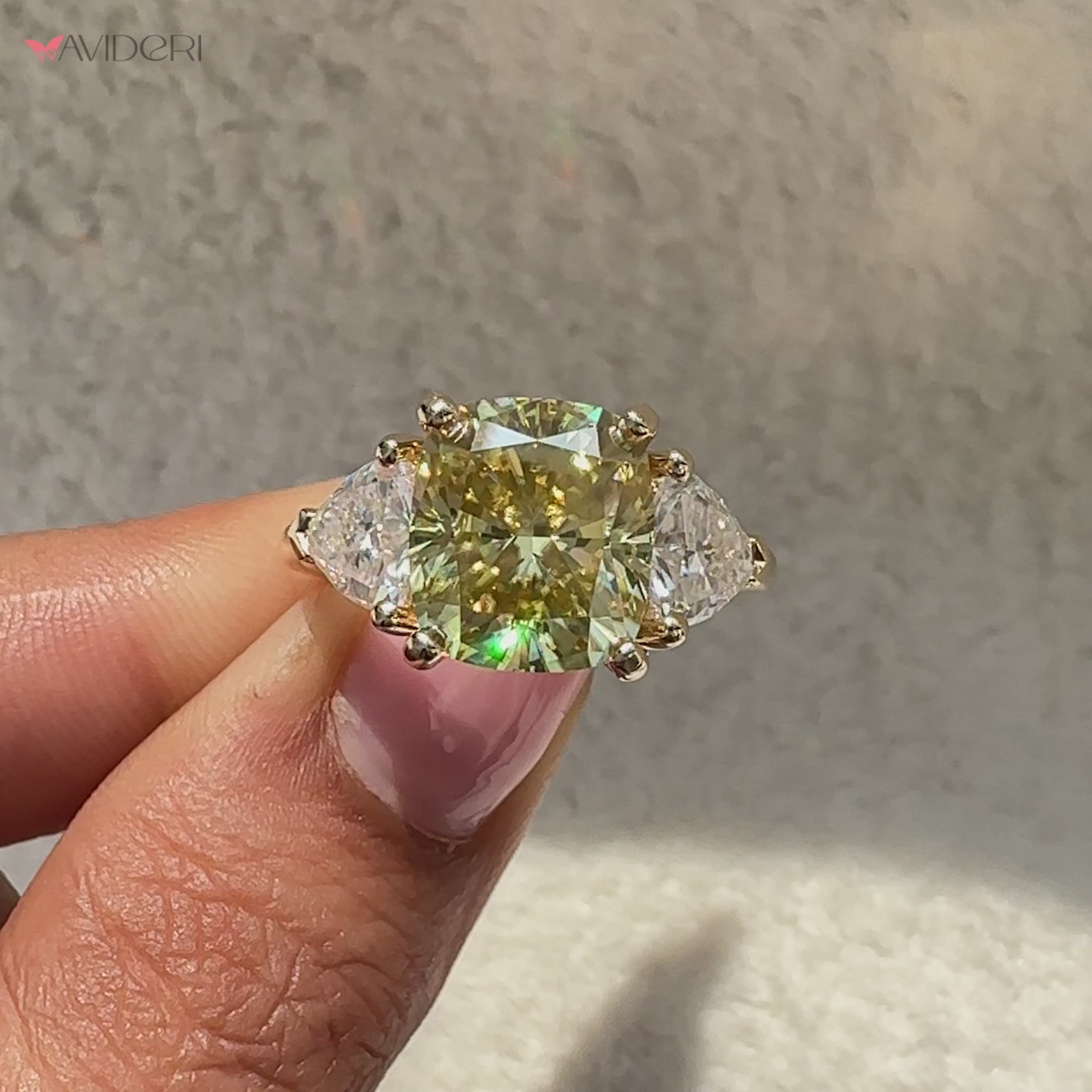 Moissanite three stone ring with modern v prong setting.
