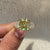 Moissanite three stone ring with modern v prong setting.
