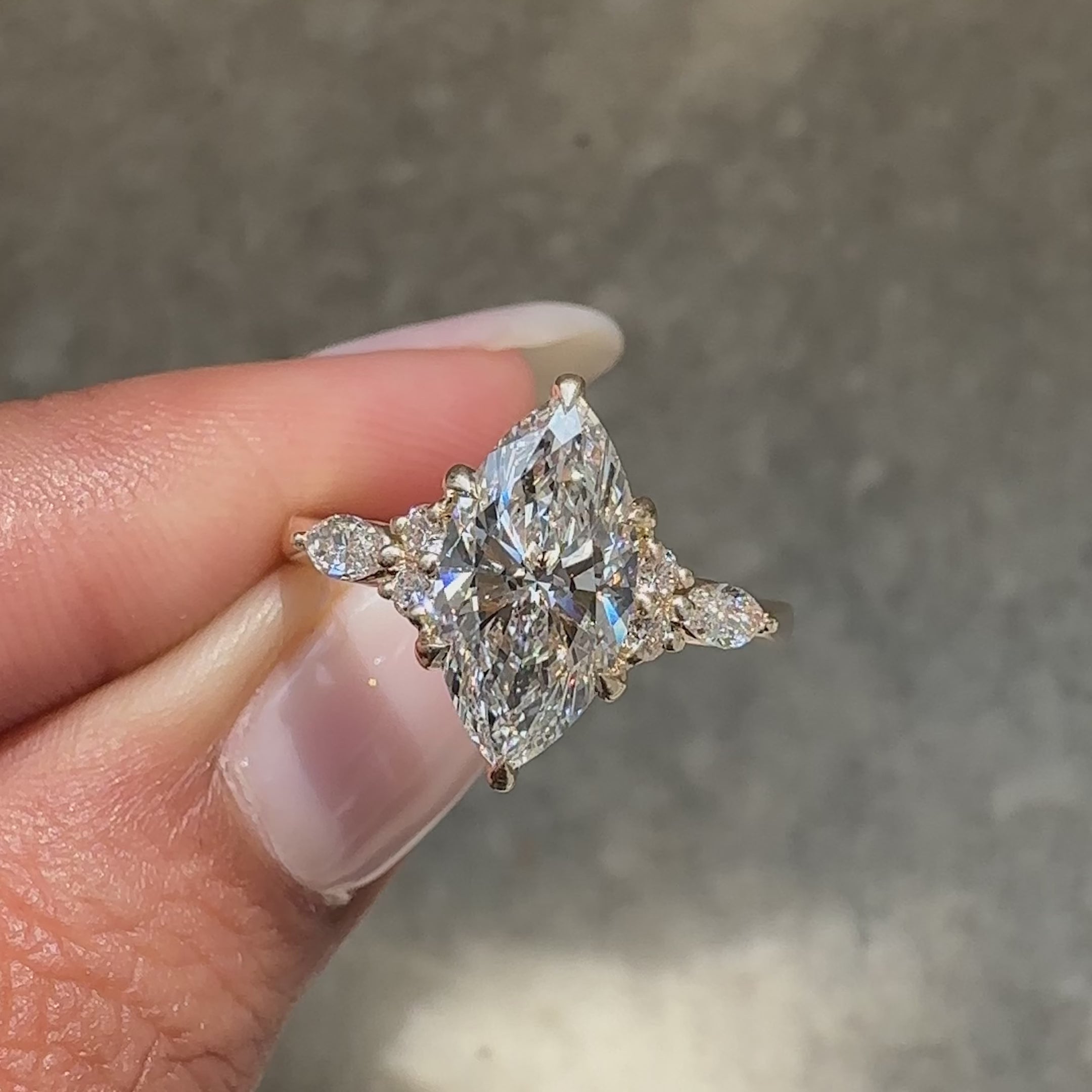 Lab grown marquise diamond ring with refined setting.
